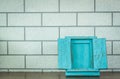 Blue photo frame on wood deck and brick wall background Royalty Free Stock Photo