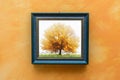 Blue picture frame on orange wall Royalty Free Stock Photo