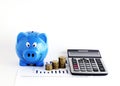 Blue piggy bank and calculatr money coins for loans concept