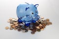 Blue piggy bank on Canadian pennies Royalty Free Stock Photo