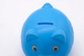 Blue piggy bank or money box isolated on a white background Royalty Free Stock Photo