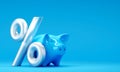 Blue piggy bank with percent sign on blue background