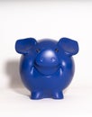 Blue piggy bank on white background Royalty Free Stock Photo