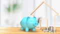 The Blue piggy bank and wood home icon 3d rendering Royalty Free Stock Photo
