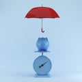 Blue Piggy savings with protection by red umbrella on blue background.