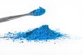 blue pigment, dry paint on a white background, macro Royalty Free Stock Photo