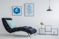 Blue pillow on black chaise lounge Royalty Free Stock Photo