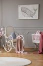 Blue pillow and paste pink blanket on white rocking chair in elegant baby room bedroom in tenement house Royalty Free Stock Photo