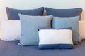 Blue pillows on a bed arrangement.