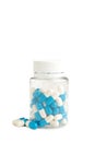 Blue pills in a bottle isolated on white background Royalty Free Stock Photo