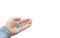 Blue Pills medical tables in man hand hold isolated on white copy space Royalty Free Stock Photo