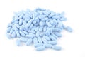 Blue pills on white background