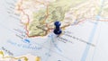 A blue pin stuck in Gibraltar on a map of Spain Royalty Free Stock Photo