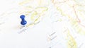 A blue pin stuck in the island of Iona on a map of Scotland Royalty Free Stock Photo