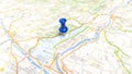 A blue pin stuck in Lake Garda on a map of Italy