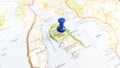 A blue pin stuck in a map of the island of Arran Scotland Royalty Free Stock Photo