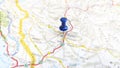 A blue pin stuck in Mostar on a map of Croatia