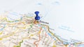 A blue pin stuck in Palermo Sicily on a map of Italy Royalty Free Stock Photo
