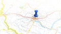 A blue pin stuck in Pecs in a map of Hungary Royalty Free Stock Photo