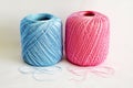 Blue and pink ball of yarn, on white background. Royalty Free Stock Photo