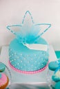 Blue and pink birthday cake with pearls big crown for little baby girl and decorations for party Royalty Free Stock Photo