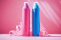 Blue and pink bottle of haircare products on pink background. Plastic bottles with shampoo and conditioner. Shop smartly Royalty Free Stock Photo