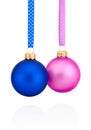 Blue and pink Christmas ball hanging on ribbon Isolated on white Royalty Free Stock Photo