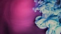 Blue pink clouds of ink in liquid. black background Royalty Free Stock Photo