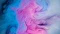 Blue pink clouds of ink in liquid. black background Royalty Free Stock Photo