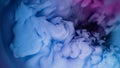 Blue pink clouds of ink in liquid. black background Royalty Free Stock Photo