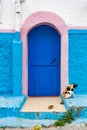 Blue and Pink Door with a Cat in front of a Home in the Kasbah of the Udayas in Rabat Morocco Royalty Free Stock Photo