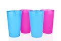 Blue pink empty plastic cups white background isolated close up, four disposable blank drinking glasses, party beverage, cocktail Royalty Free Stock Photo