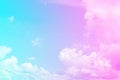Blue and pink fluffy thick clouds against blue sky. Color toning duaton. Natural background wallpaper. Horizontal frame. Royalty Free Stock Photo