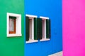 Blue, pink and green painted facades of the houses. Colorful architecture in Burano, Italy Royalty Free Stock Photo