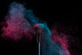 Blue and pink makeup on powder brush hit in a mixed cloud Royalty Free Stock Photo