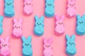 Blue and pink marshmallow bunnies on pink