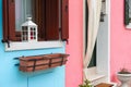 Blue and pink painted facade of the house. Colorful architecture in Burano, Italy Royalty Free Stock Photo