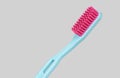 Blue and pink plastic toothbrush sideways isolated Royalty Free Stock Photo