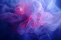 a blue and pink smoke swirl on a dark background Royalty Free Stock Photo