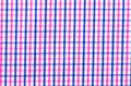Blue and pink tartan or plaid background.
