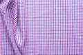 Blue and pink tartan or plaid background.