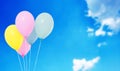 Blue,pink,yellow balloons on blurred sky background,copy space, holidays,celebration Royalty Free Stock Photo