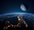 Blue planet earth with city lights in space on the starry sky with the moon. Moon with craters near the planet. Nightlife Italy Royalty Free Stock Photo