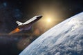 Blue planet Earth. Space shuttle taking off on a mission. Royalty Free Stock Photo