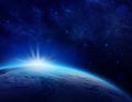 Blue Planet Earth, sunrise over cloudy ocean of world in space Royalty Free Stock Photo