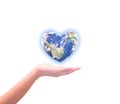 Blue planet in heart shape over woman human hands isolated