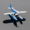 Blue plastic aquaplane on the grey mirror background Royalty Free Stock Photo