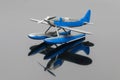 Blue plastic aquaplane on the grey mirror background Royalty Free Stock Photo