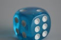 Blue plastic arcylic d6 six sided die dice close up variable focus