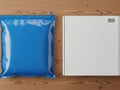 Blue plastic bag and white box placed side by side on a wooden surface Royalty Free Stock Photo